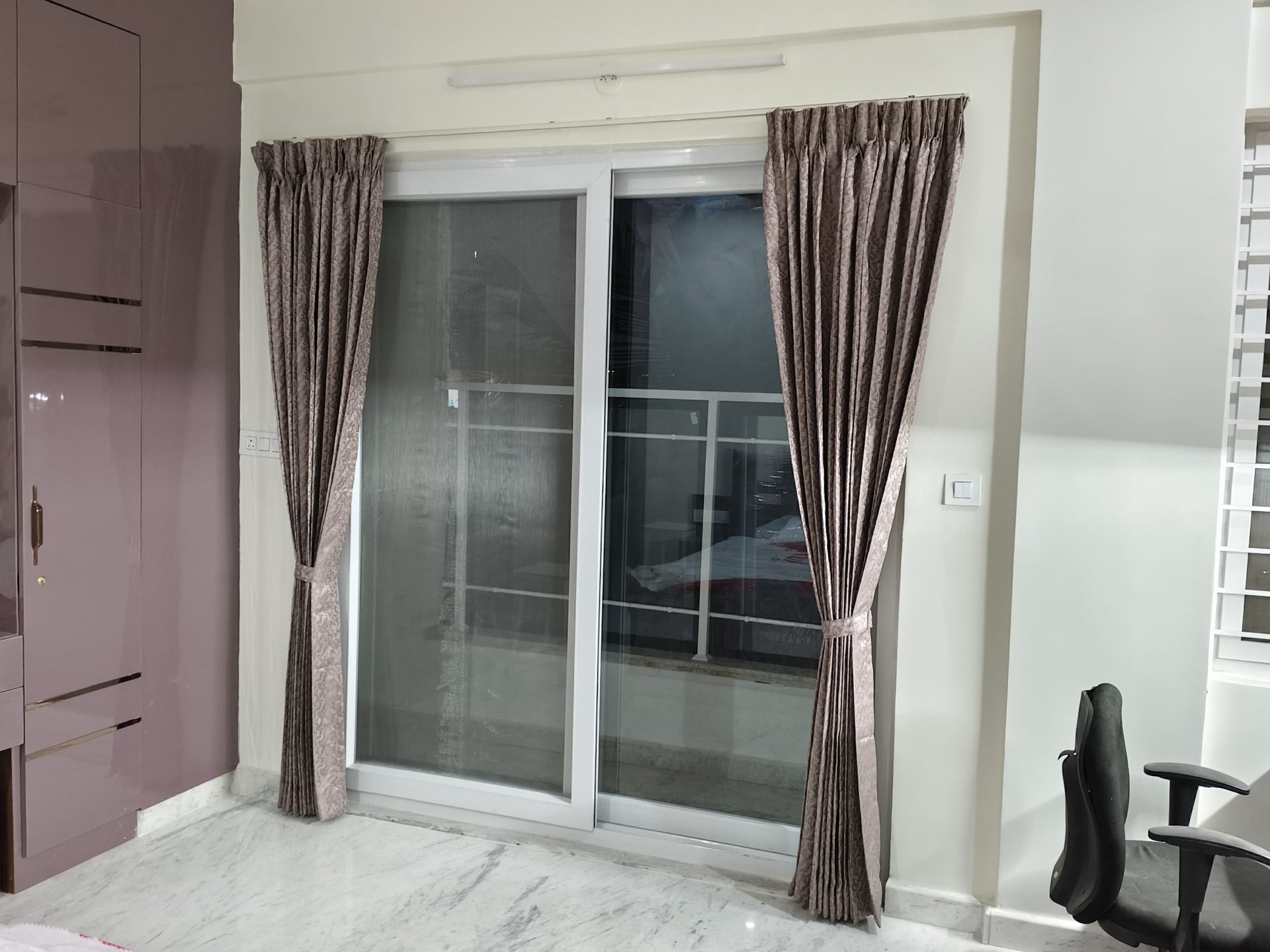 Bedroom — Patterned drape with tiebacks